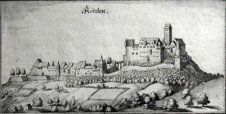 Hilltop castle with tall central tower and surrounding curtain walls overlooking a village and farmland.