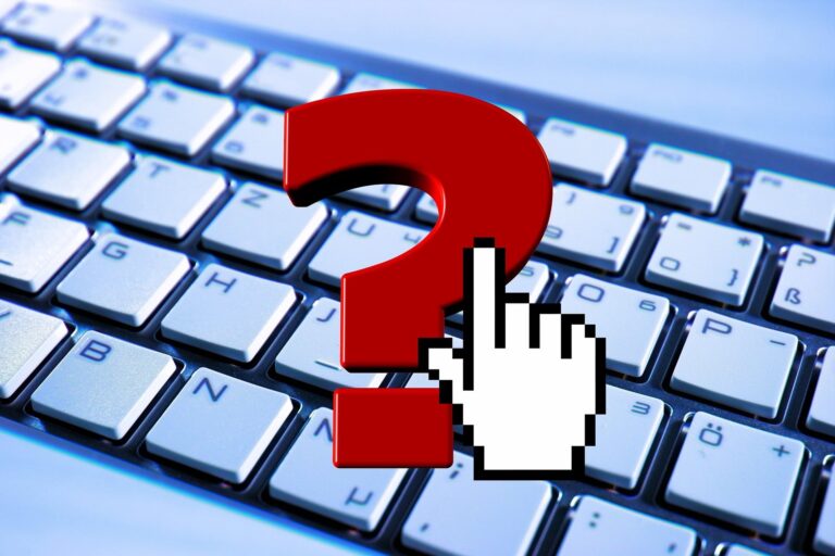 Red question mark overlaying a computer keyboard, with a pixelated white hand cursor poised to click.