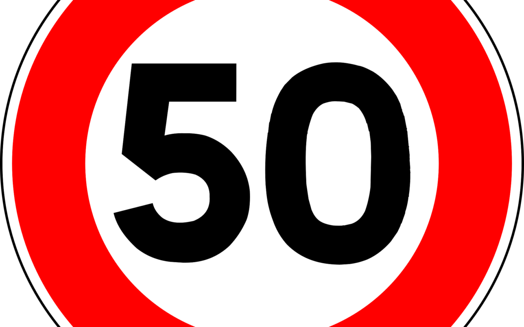 Speed limit sign: the number 50 inside a red circular border on white background