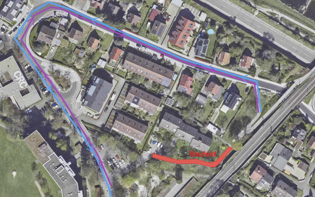 Aerial view of a residential area with blue and purple route lines overlaid along streets and a red construction site label Bauefeld is visible nearby.