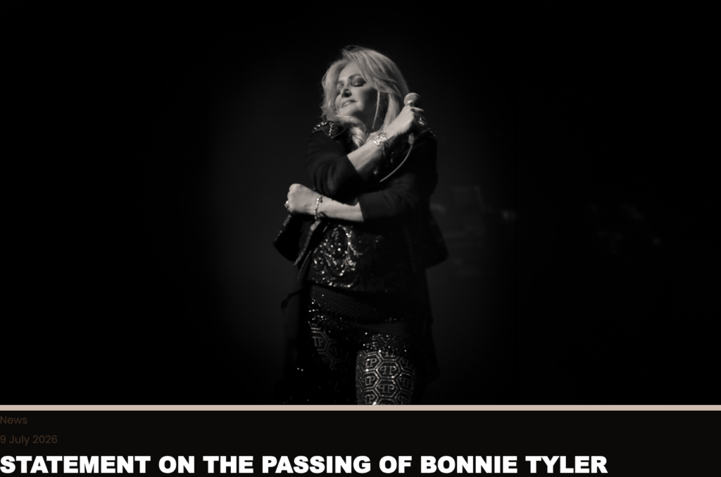 Black-and-white photo of a female singer on stage, holding a microphone with eyes closed in a moment of performance.