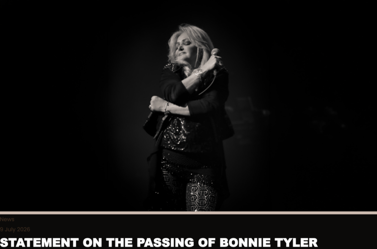 Black-and-white photo of a female singer on stage, holding a microphone with eyes closed in a moment of performance.