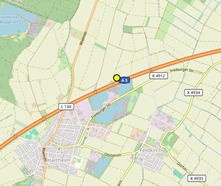 Map excerpt of Hartheim area showing the A5 highway with a yellow pin marker near Freiburger Straße and nearby roads (K4912, L134).