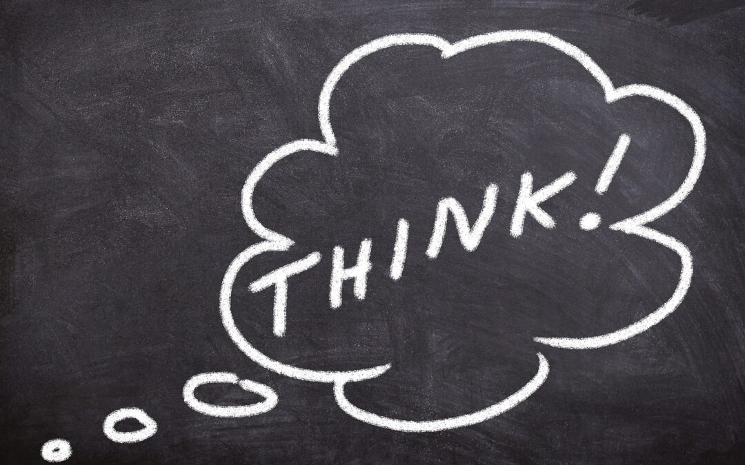 Chalk drawing of a thought bubble with the word THINK! on a dark chalkboard surface.