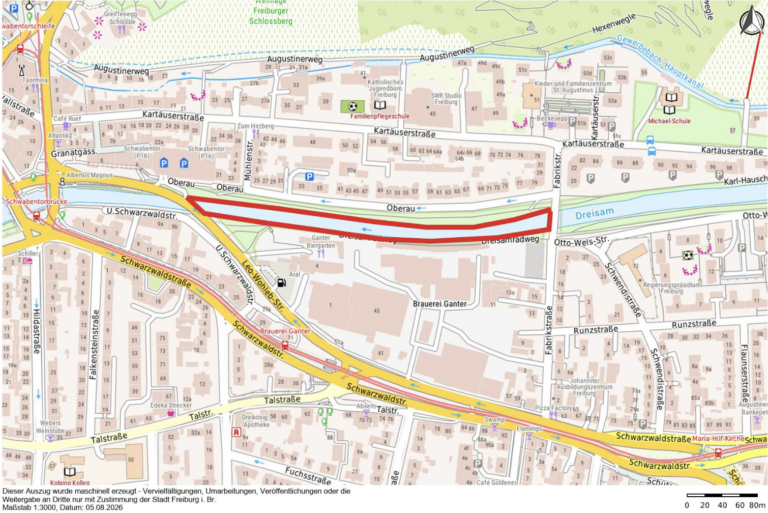 City map highlighting a red curved route along the Dreisam river, running from the Oberau area toward the Dreisamstraße area in Freiburg.